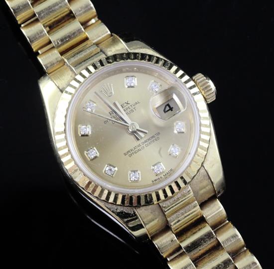 A ladys modern 18ct gold and diamond set Rolex Oyster Perpetual Datejust wrist watch,